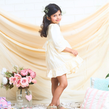 off-white layered party and bithday wear dress with lace waist belt and pleated ruffle hem  3/4 sleeves white