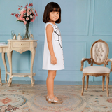 Charming White Dress Featuring a Bow and Button Sketch Print