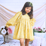 Pinkcow Fashions yellow floral print party and birthday wear babydoll dress with gathered waist and ruffled bishop sleeves long sleeves yellow