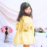 Pinkcow Fashions yellow floral print party and birthday wear babydoll dress with gathered waist and ruffled bishop sleeves long sleeves yellow