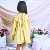 Pinkcow Fashions yellow floral print party and birthday wear babydoll dress with gathered waist and ruffled bishop sleeves long sleeves yellow