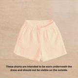 Cotton Woven Sleeveless Ruffled Dress  With Pink Bow And Shorts