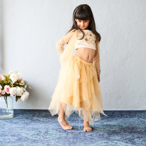 Chic and charming in a golden layered lehenga