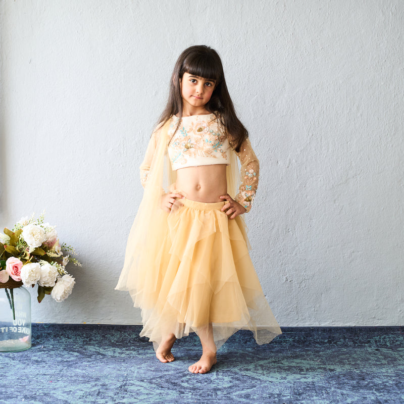 Chic and charming in a golden layered lehenga