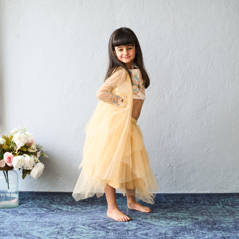 Chic and charming in a golden layered lehenga