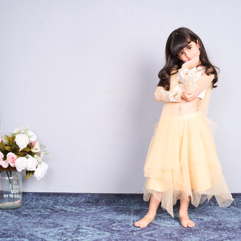 Chic and charming in a golden layered lehenga