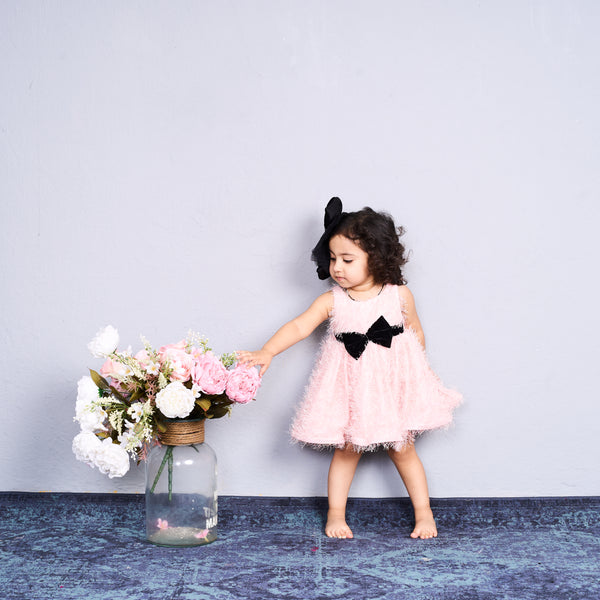 Adorable in blush pink – this bow dress is perfect