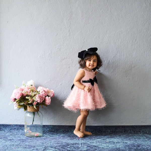 Adorable in blush pink – this bow dress is perfect