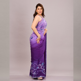 A elegant purple saree with intricate embroidery and sheer fabric