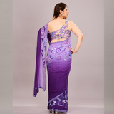 A elegant purple saree with intricate embroidery and sheer fabric