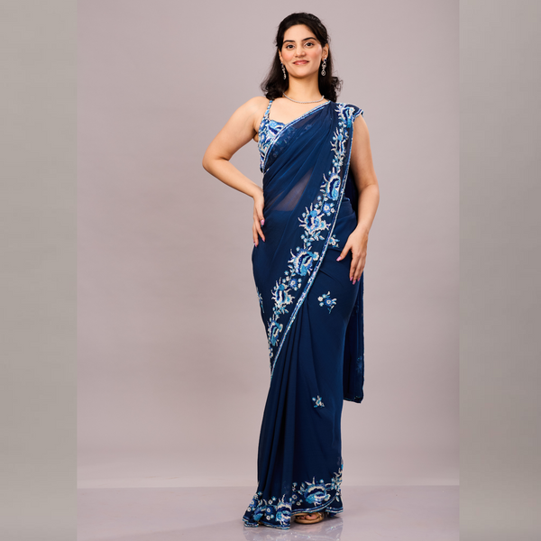 Navy blue sequined georgette saree with a sleeveless blouse