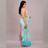 A pastel blue and pink net saree with delicate floral embroidery, paired with a matching embroidered blouse.