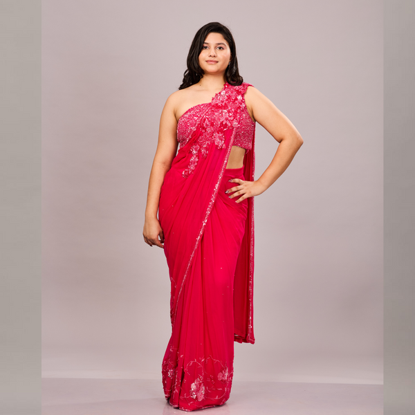 vibrant pink, one-shoulder saree with intricate sequin and floral embroidery