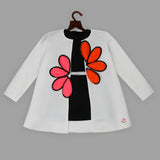 White jacket with floral embellishments